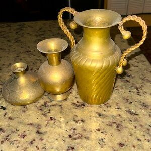 three metal vases, made in India